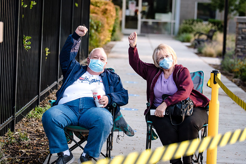 Patrons in line with masks